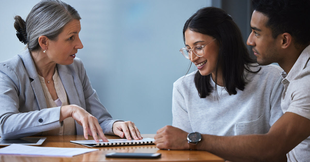 Young couple meeting with financial advisor