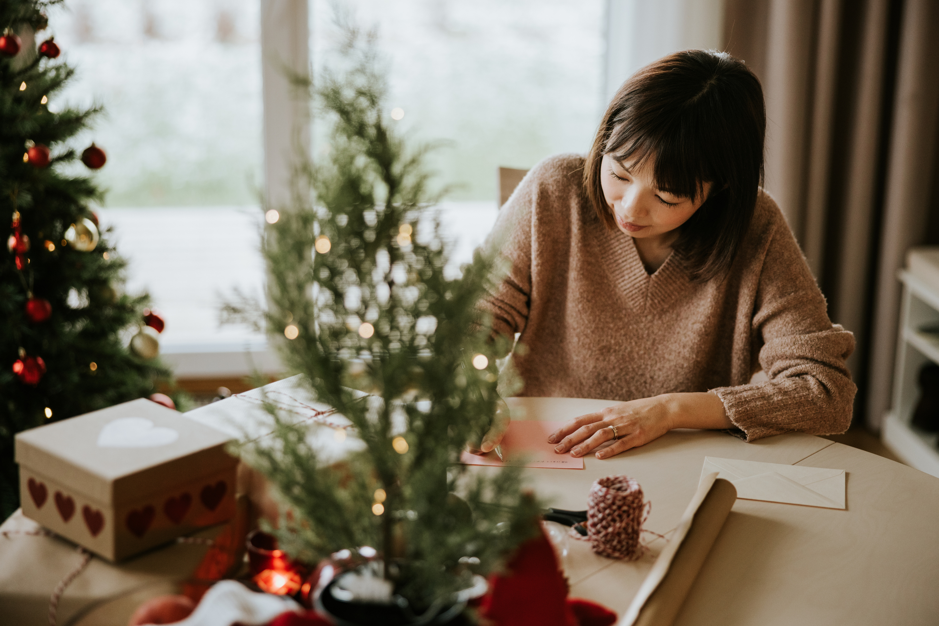 Woman writing Christmas cards