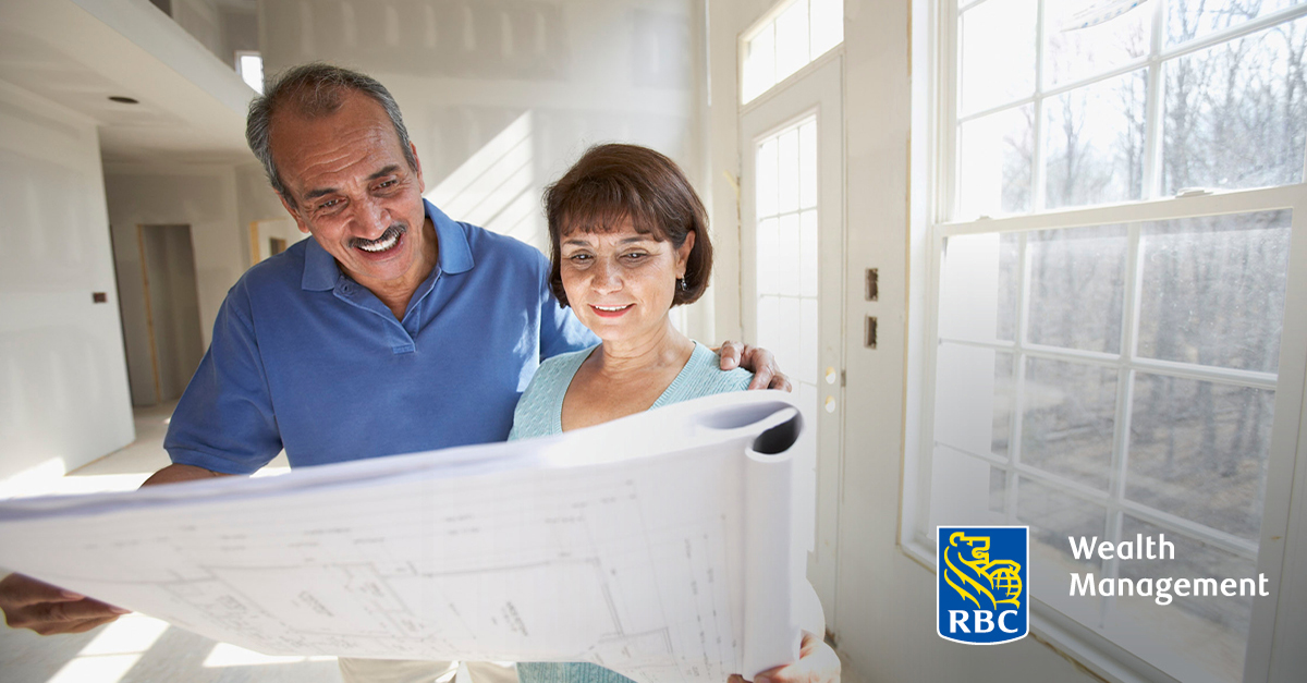 Couple looking at blueprints of a house