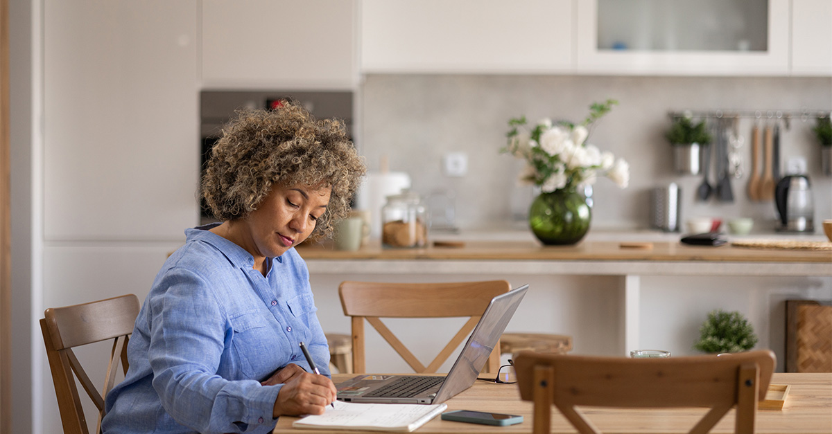 Woman at her laptop managing finances