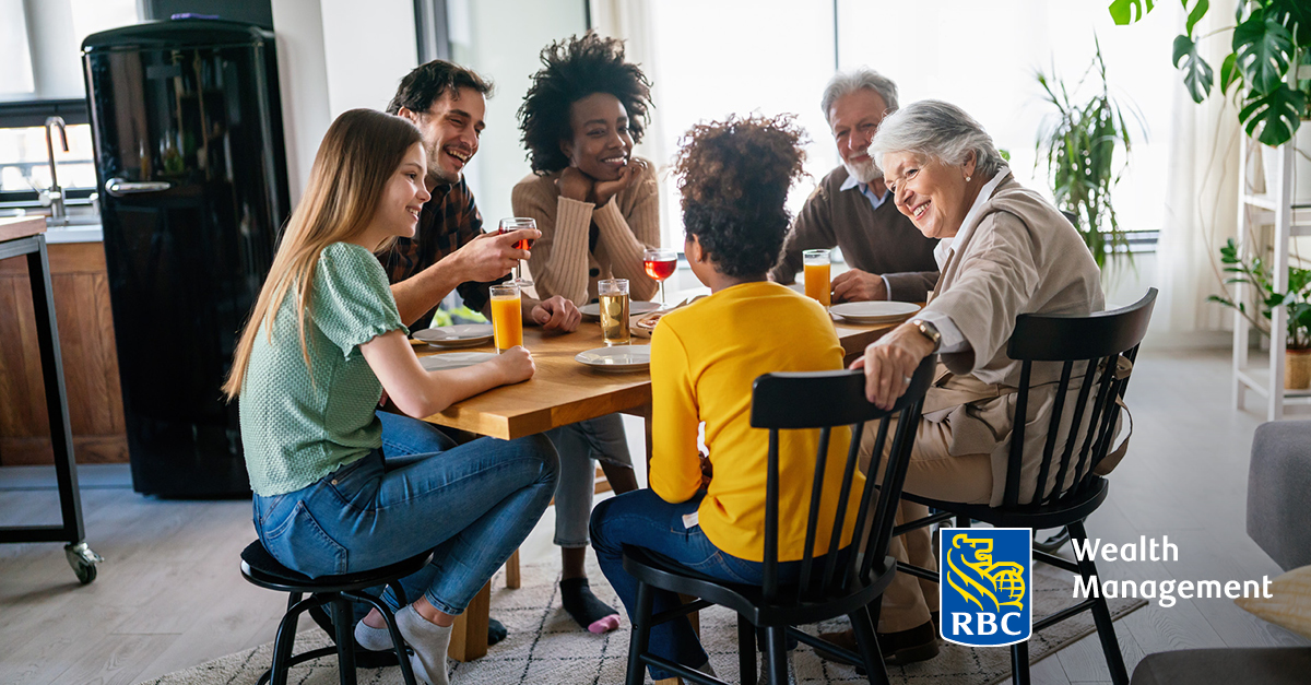 Multiple people having a discussion around the breakfast table