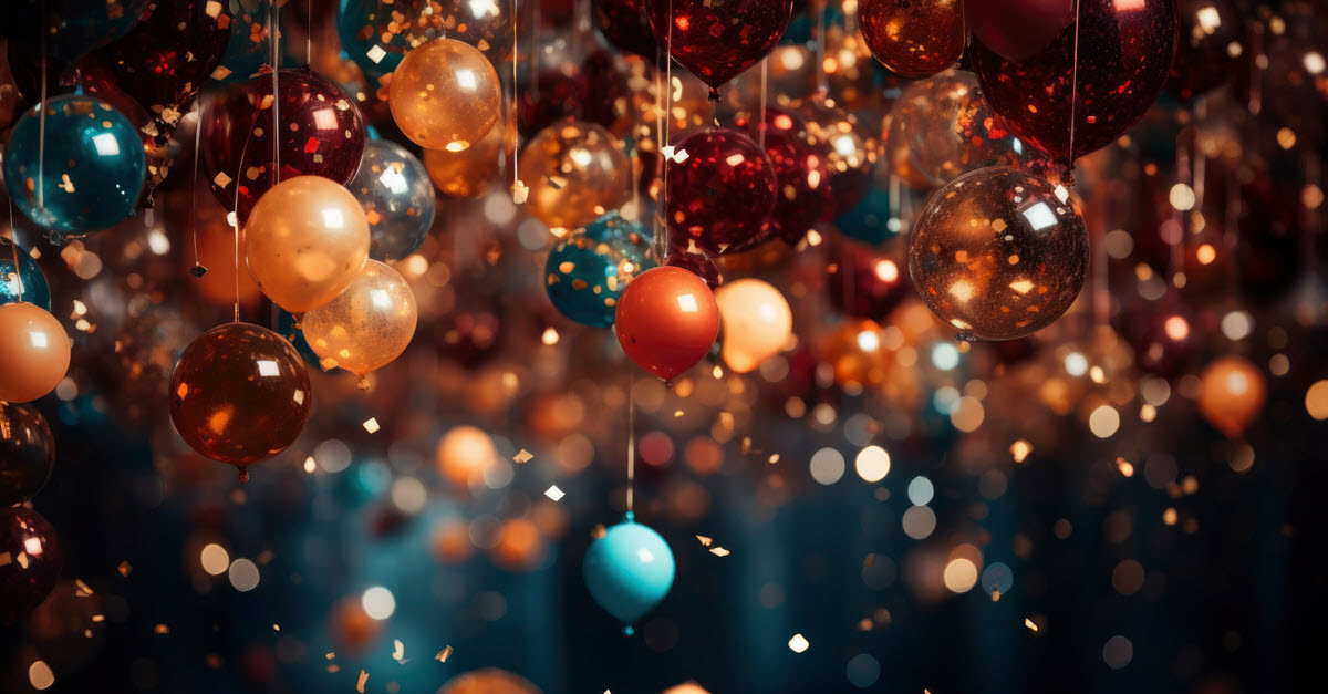 orange and gold and blue baubles and confetti hanging from ceiling