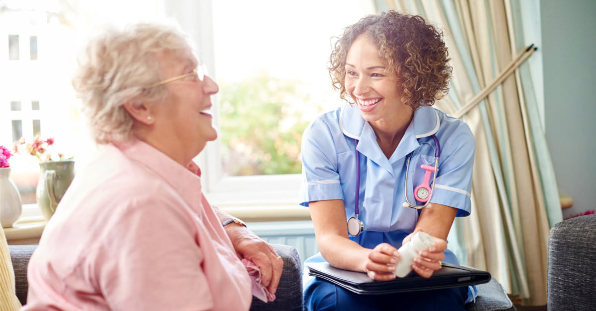 Nurse sitting with a client