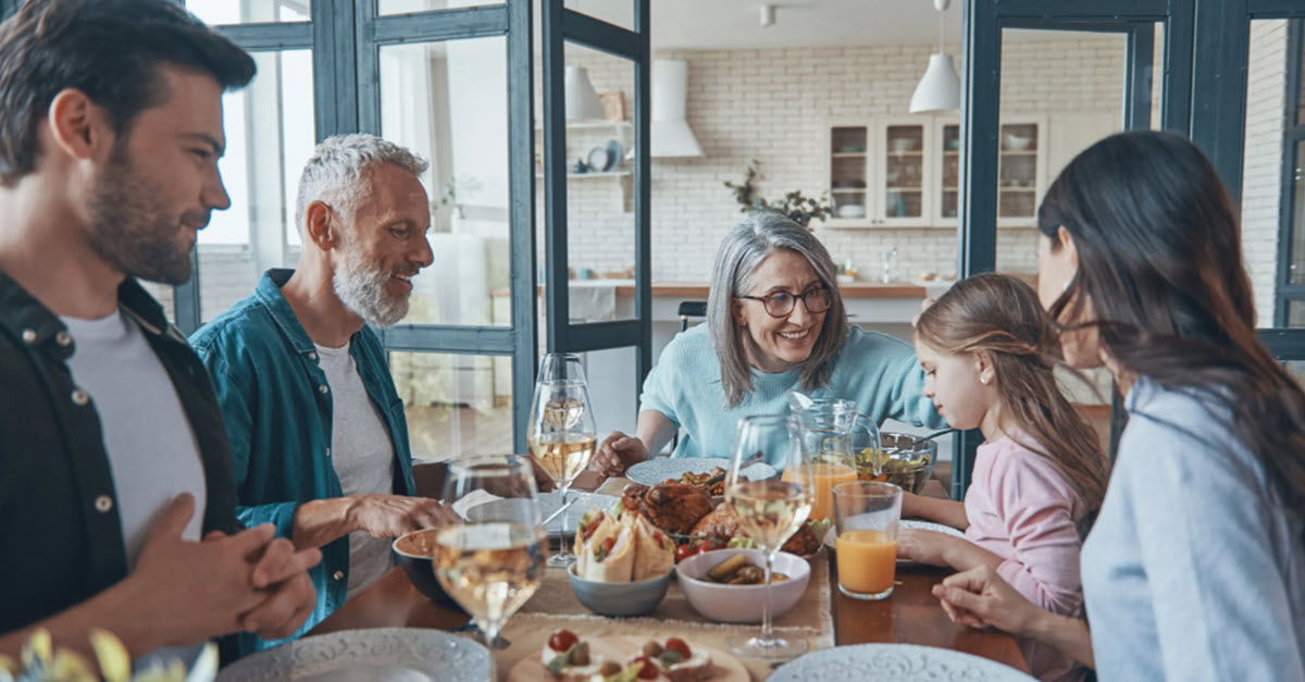 Family sitting around a table eating lunch