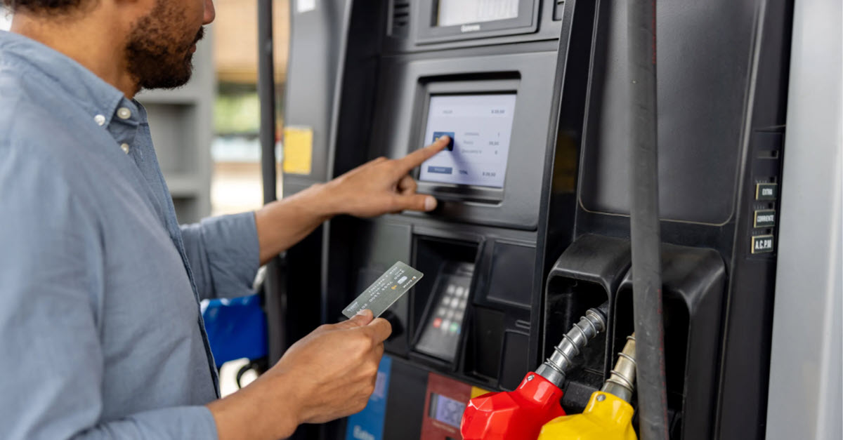 Man paying for gas at the pump