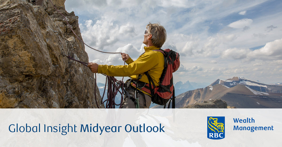 Climbers summiting mountain