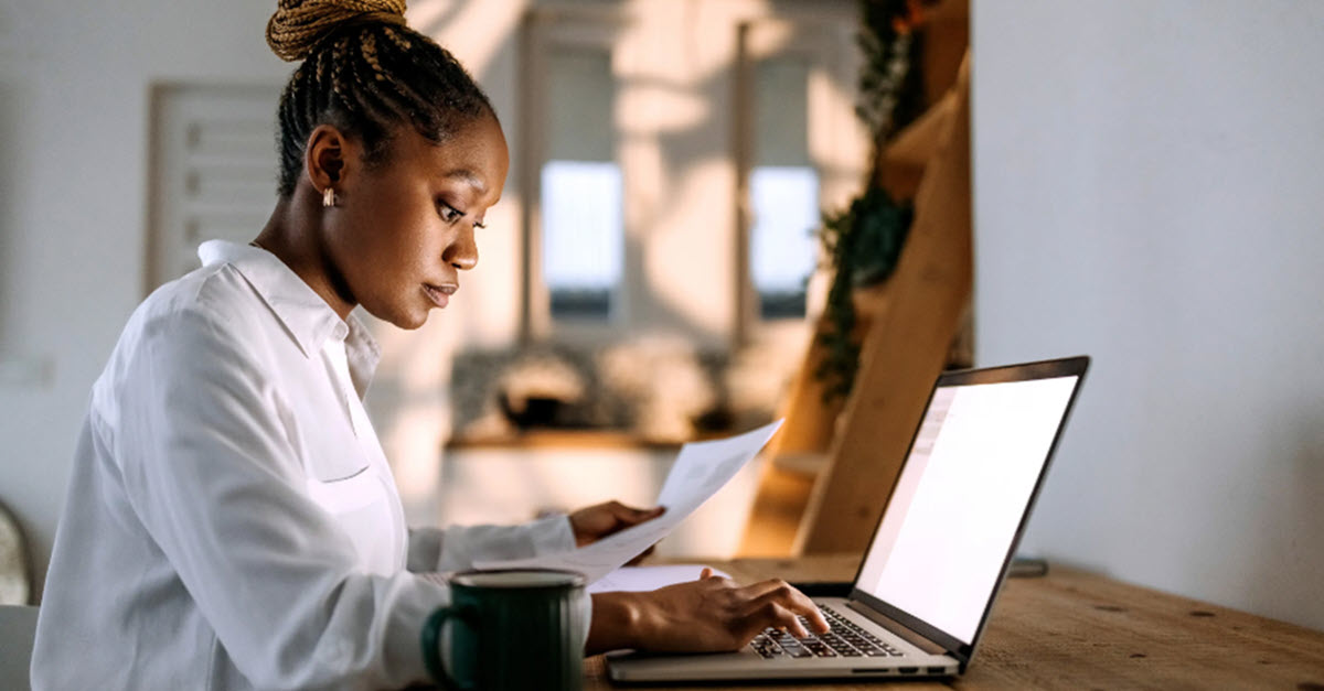 Woman inputting info into computer