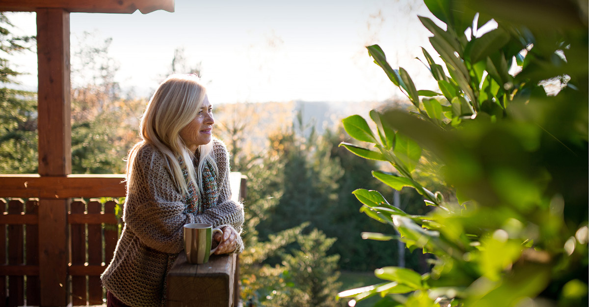 Senior women with tea on outdoor terrace
