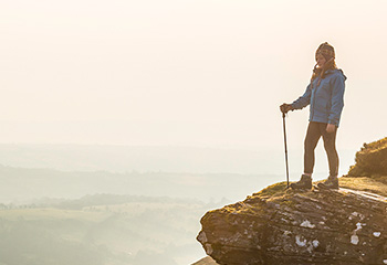 Hiker overlooking a long view