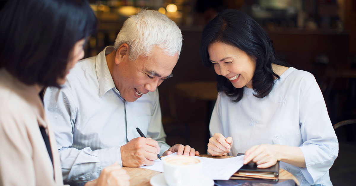 Advisor and family reviewing retirement